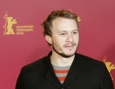 Heath Ledger Net Worth: Actor's portrait with money symbols representing his $20 million fortune at the time of death.