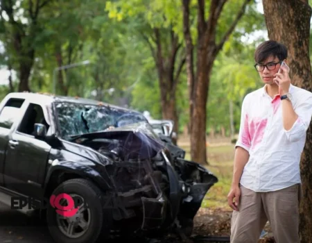 "Javo Car Accident scene with police investigators examining a damaged vehicle at an intersection."