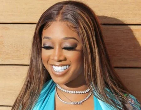 Trina, the Miami-born rapper known as the Diamond Princess, performing on stage during a concert.