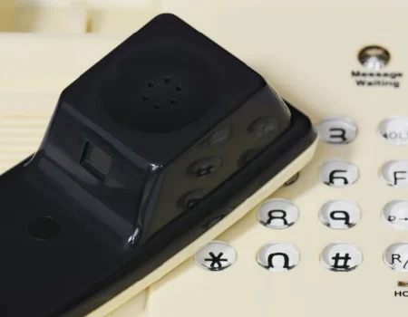 Phone keypad displaying 1-432-381-4383, highlighting the 432 area code for West Texas